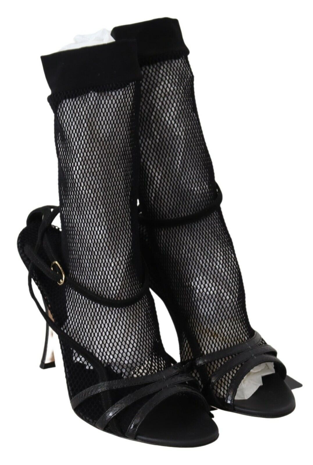 Pair of black high heel boots with fishnet pattern and straps