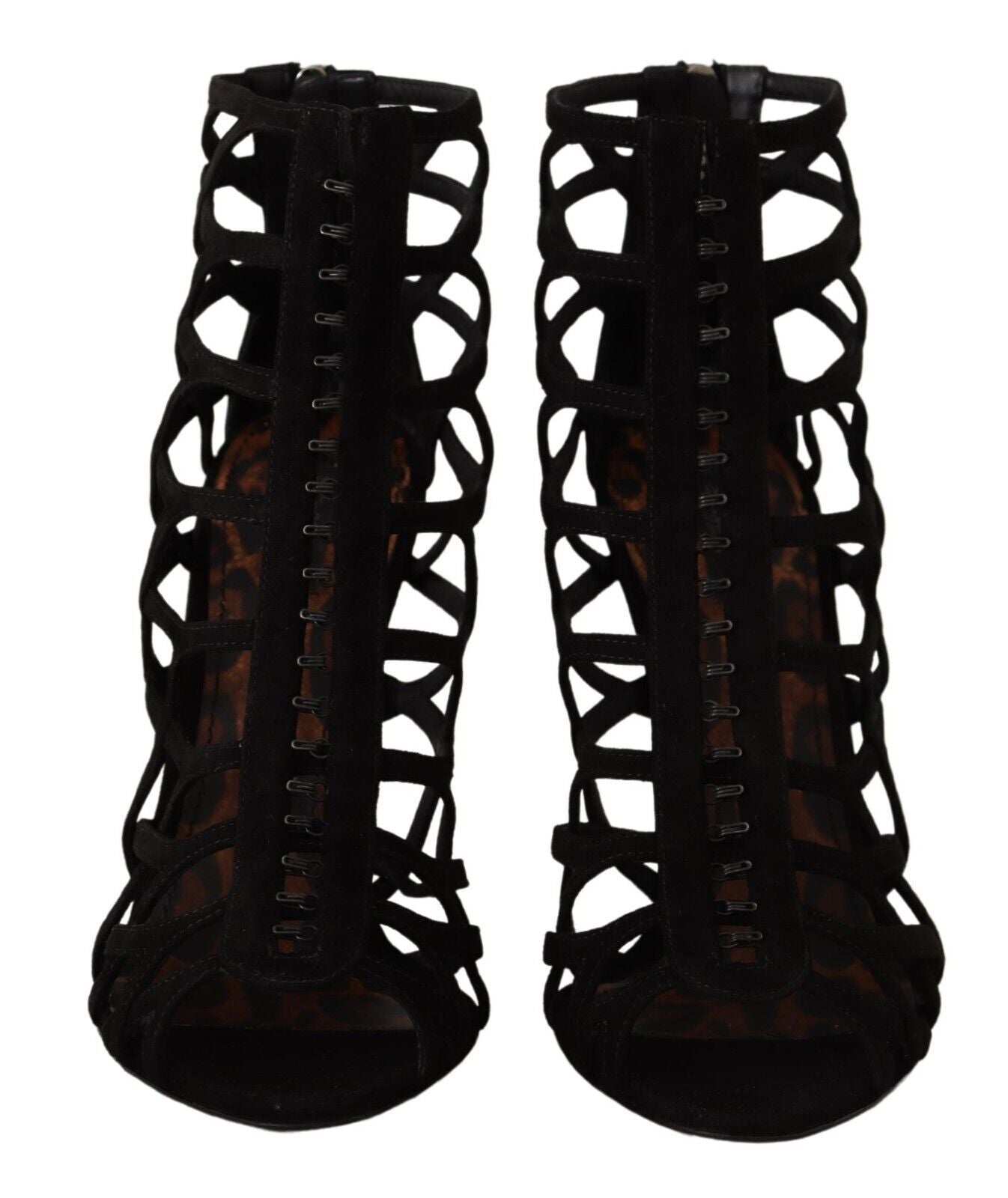 Pair of black high heel boots with lace up detailing and a patterned design on the sides