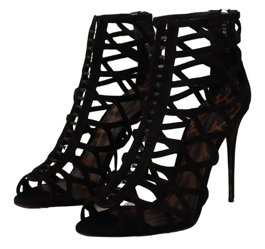 Pair of black high heel shoes with lace up detailing and a stiletto heel
