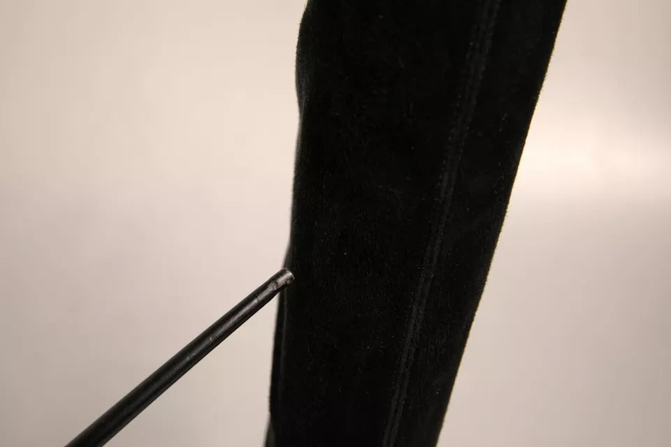 Black fabric hanging from a pole