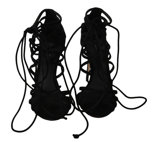 Pair of black high heel shoes with laces and ties
