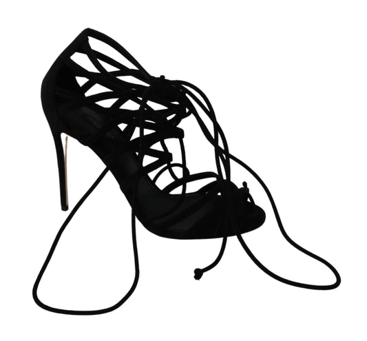 Black high heel shoe with lace detailing and a bow on top