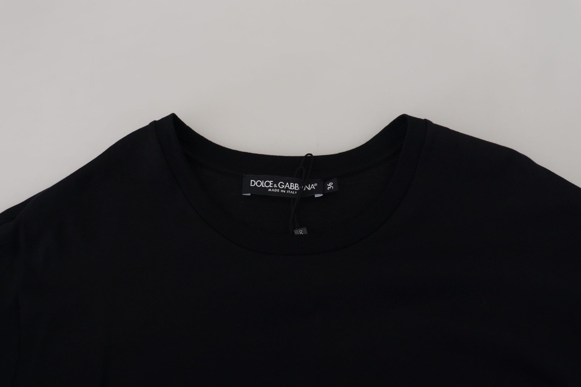 Black t-shirt on hanger