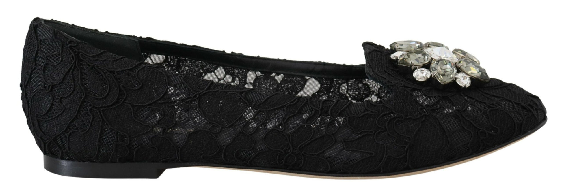 Black shoe with embellishments and a bow on top