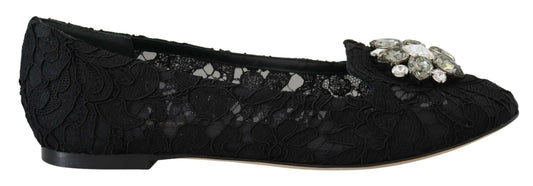 Black shoe with embellishments and a bow on top