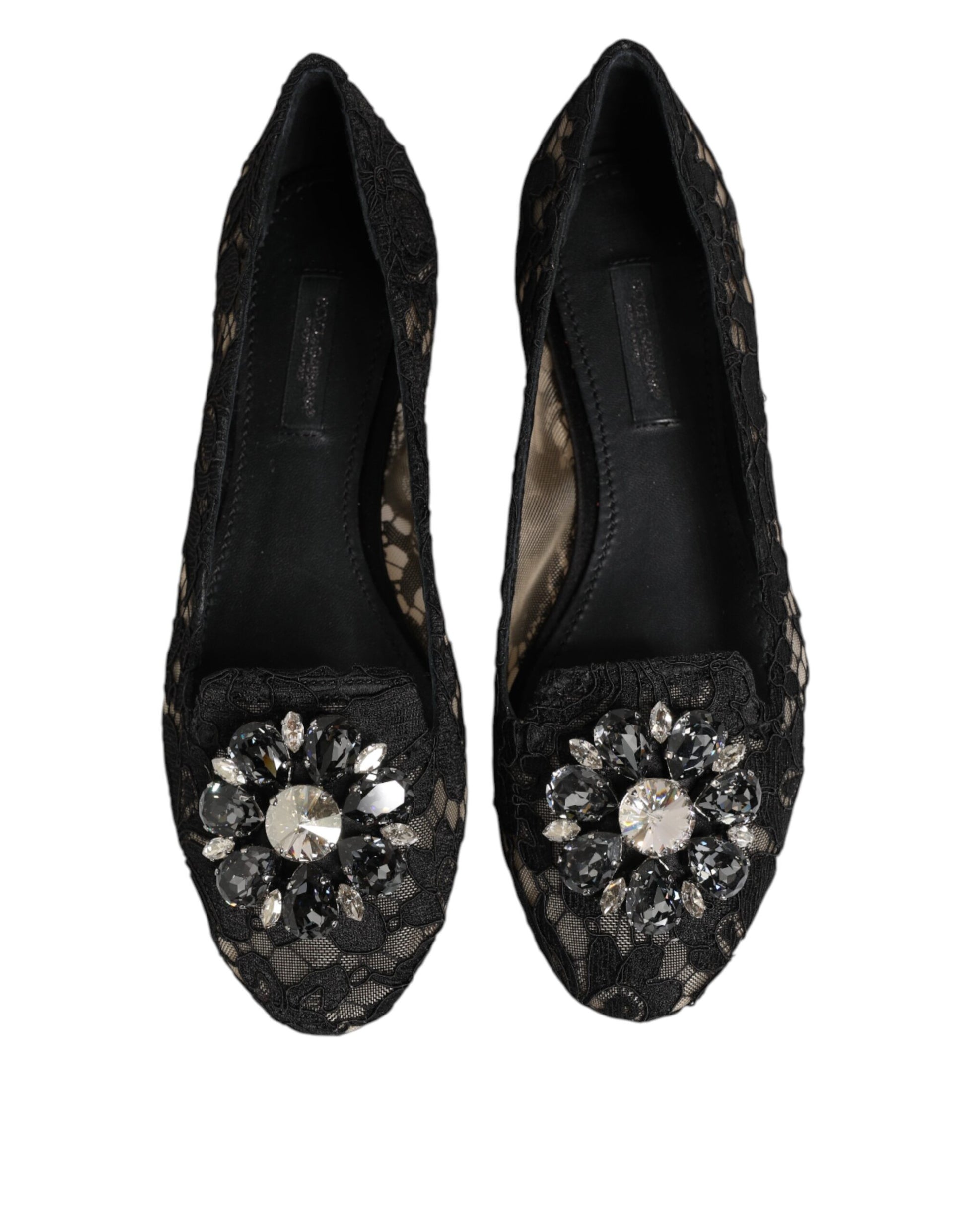 Pair of black shoes with sparkling embellishments on toe