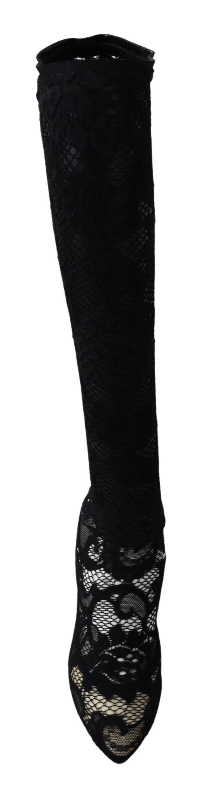Pair of black knee high boots with lace up front and embellishments on sides