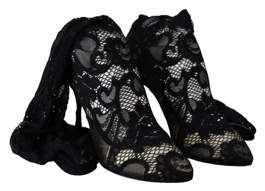 Pair of black high heel shoes with lace and embroidery detailing