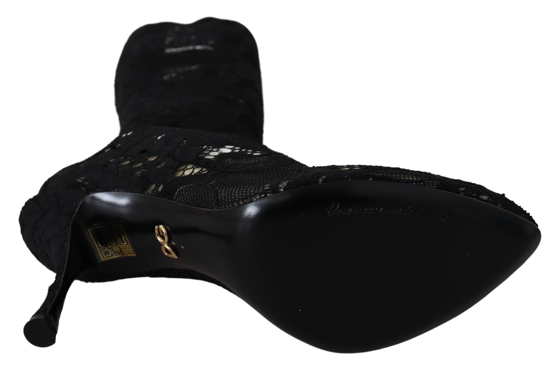 Black shoe with gold accents and a bow on top