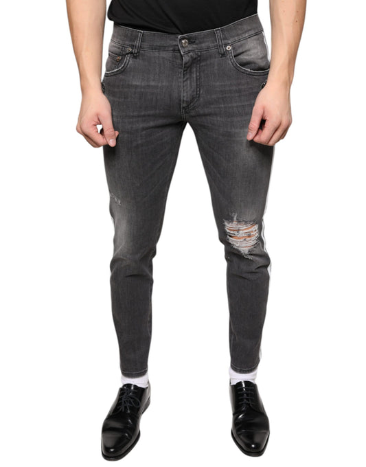 Mannequin wearing blue jeans with distressed areas