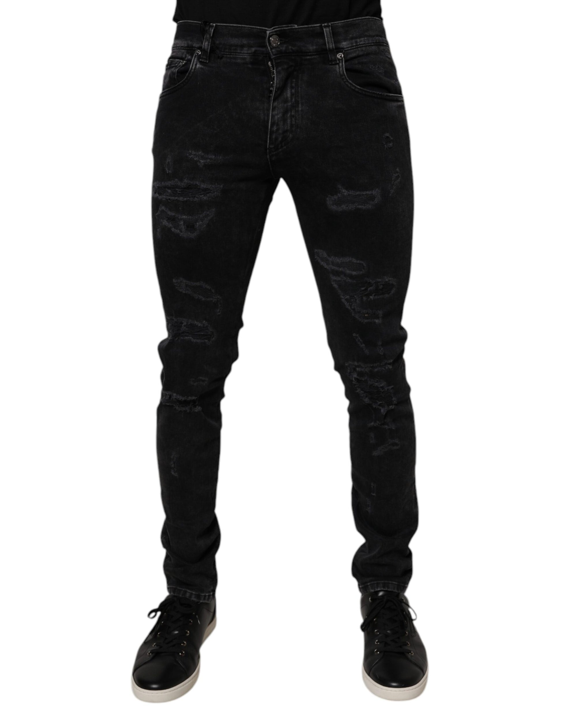 Black skinny jeans with distressed design on legs