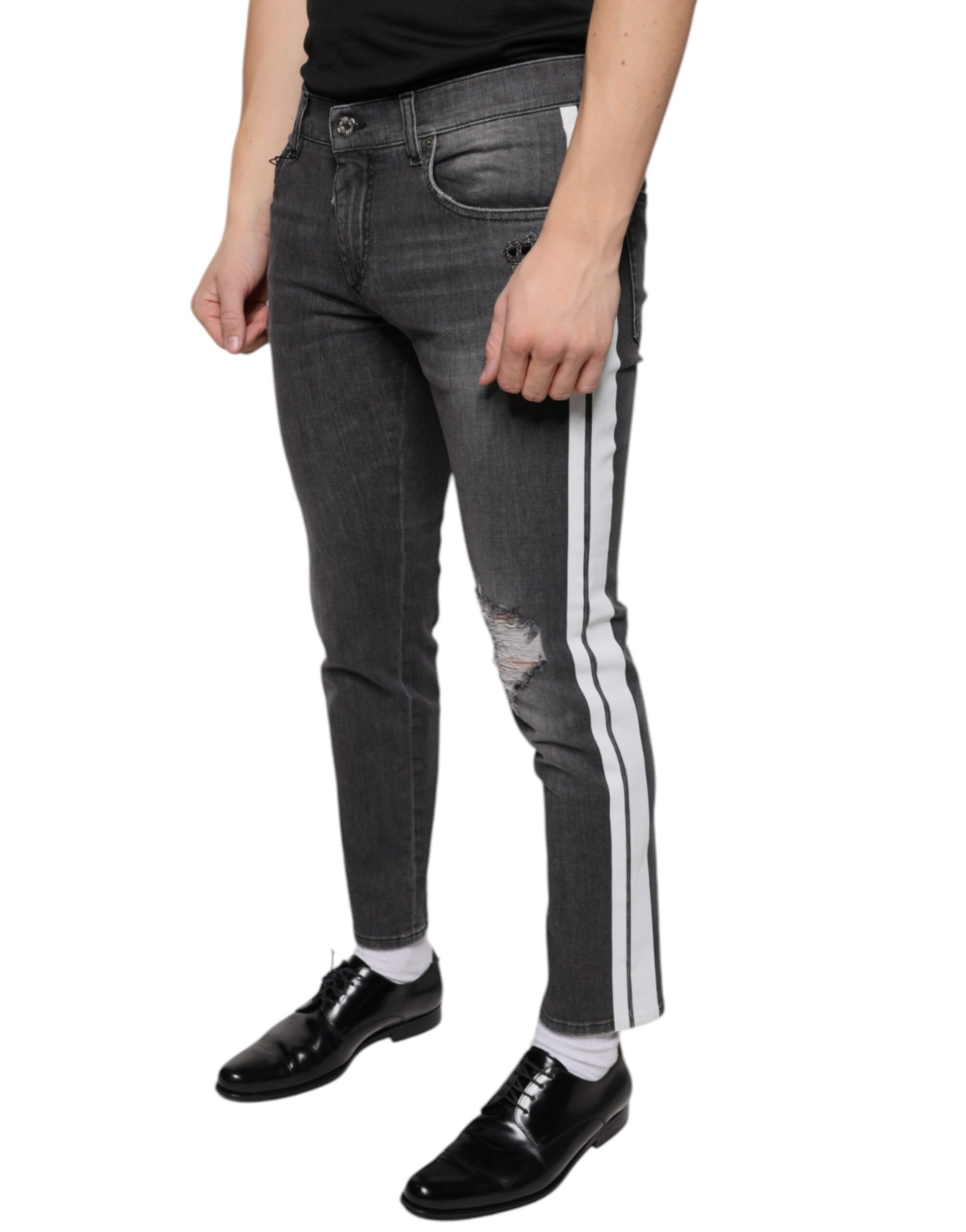 Mannequin wearing blue jeans with white stripes down sides and black shoes