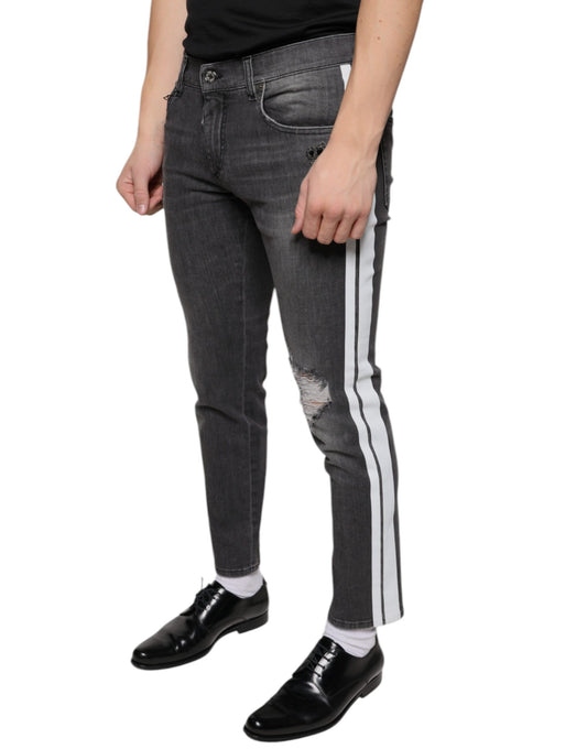 Mannequin wearing blue jeans with white stripes down sides and black shoes