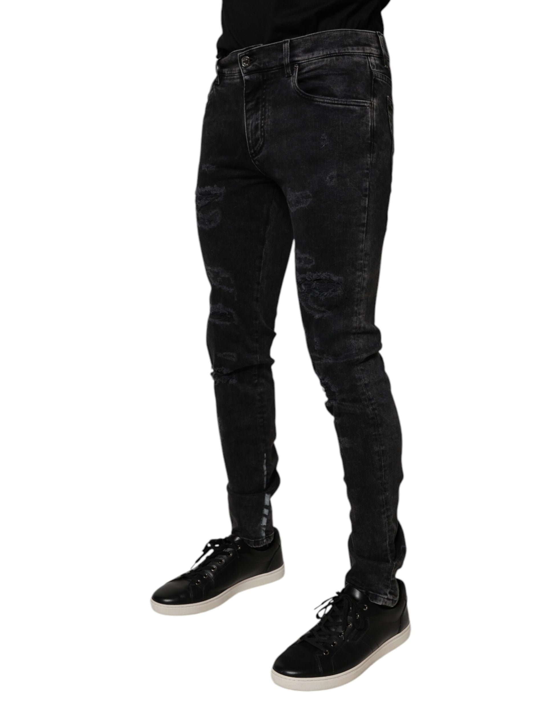 Man wearing black jeans and shoes