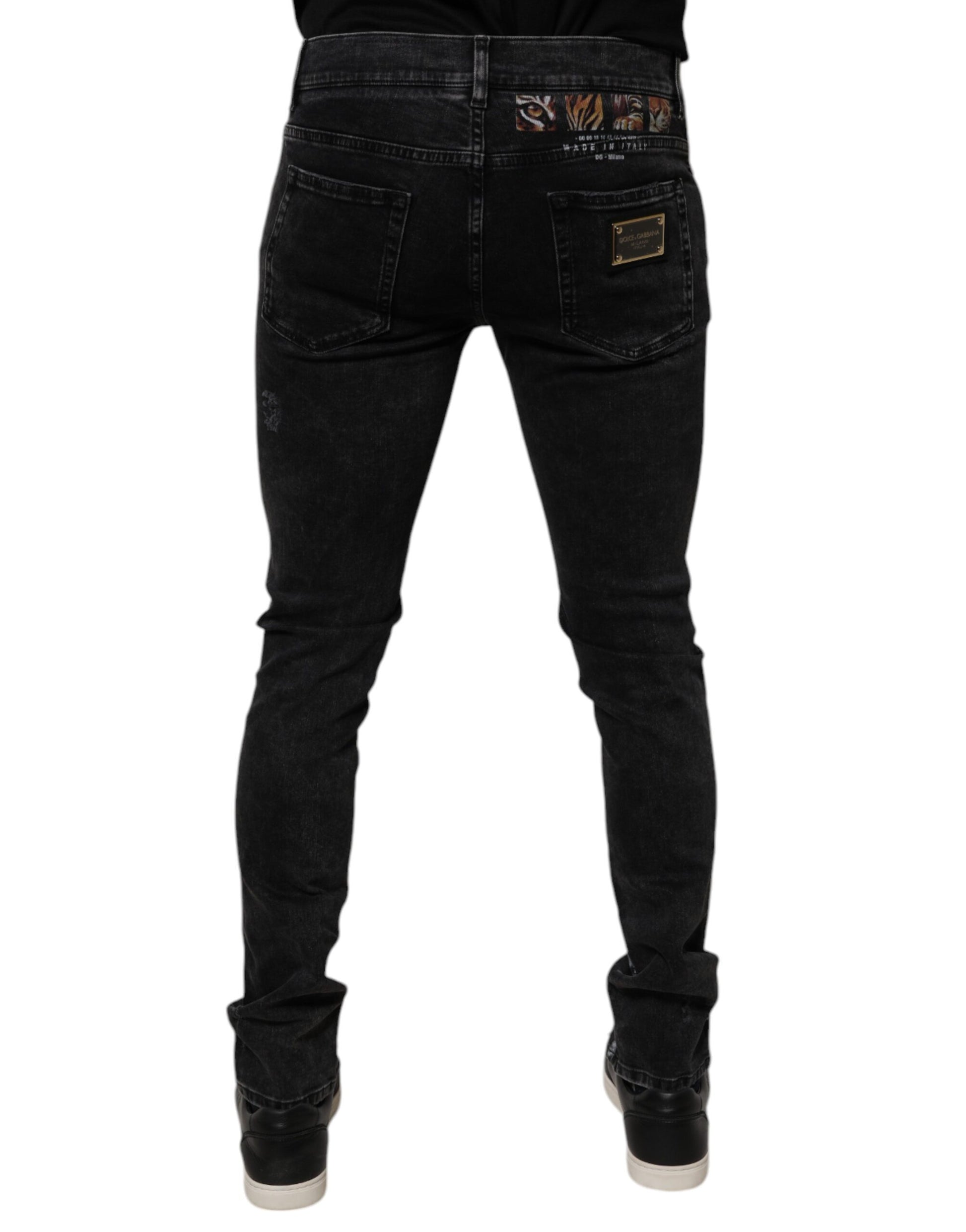 Pair of dark blue jeans with belt loops and a zipper fly