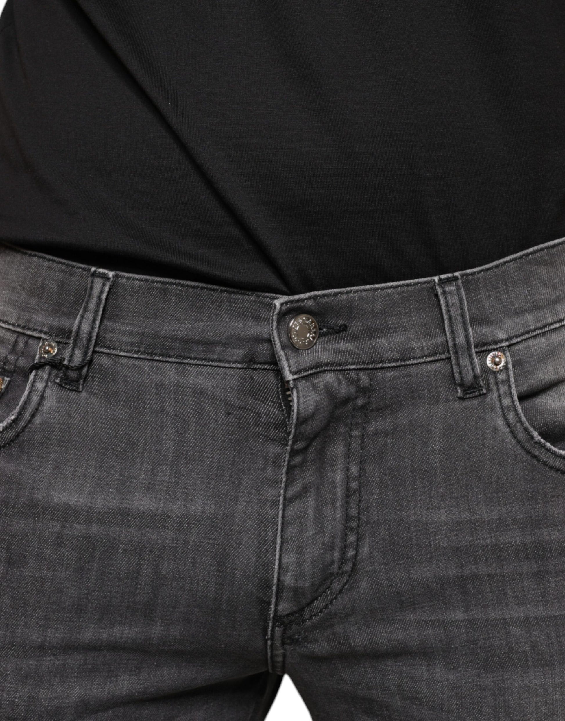 Pair of dark blue denim jeans with button closure