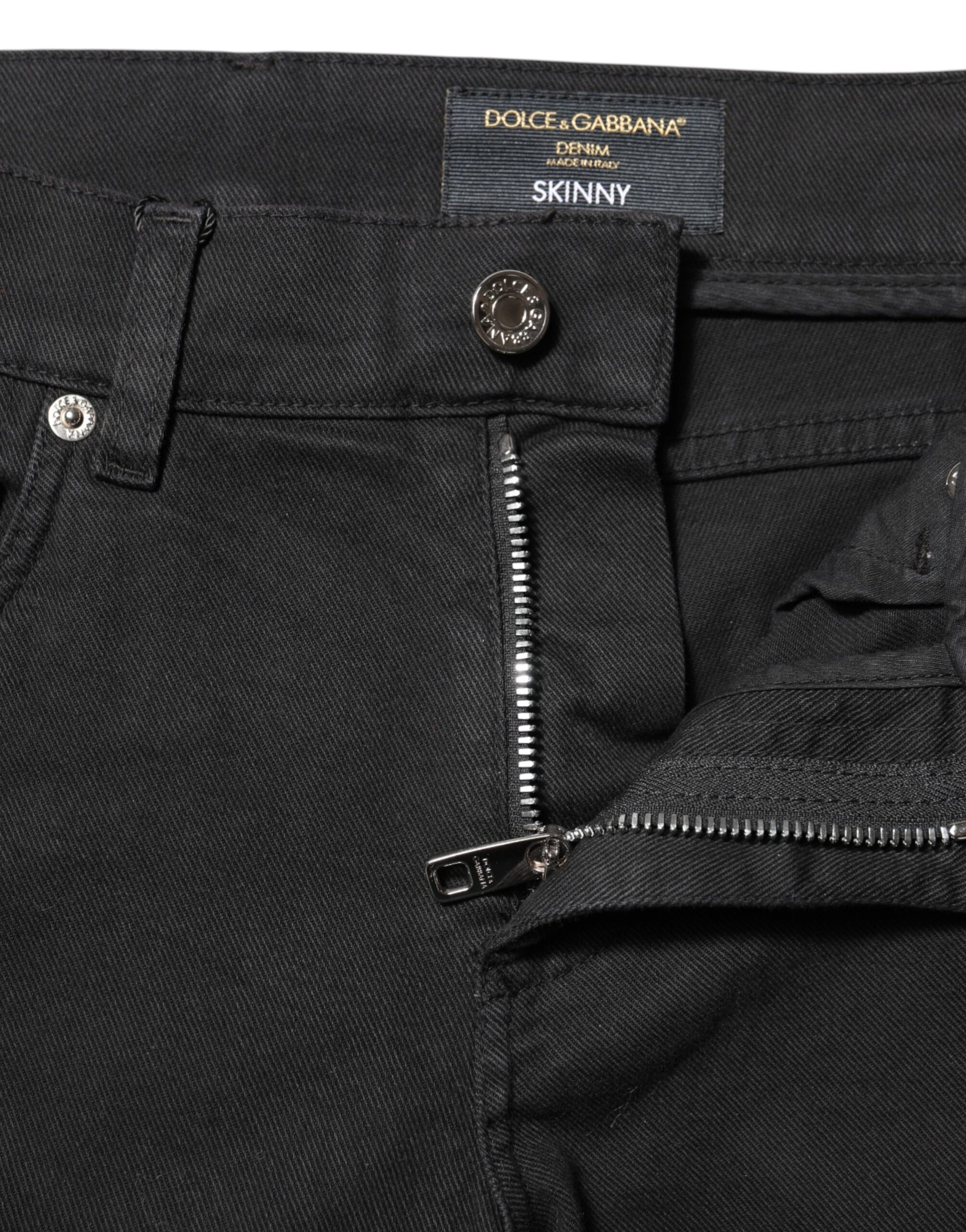Pair of dark wash jeans with zipper detailing on front