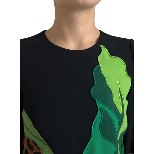 A black dress with a tiger jungle print and stretchy fabric