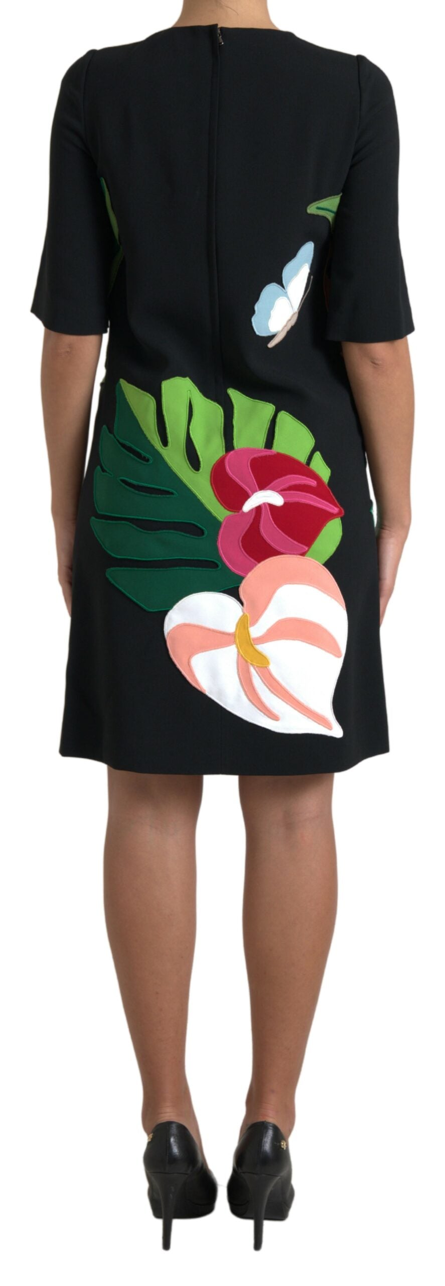 A black dress with a tiger jungle print and pink flowers on the front