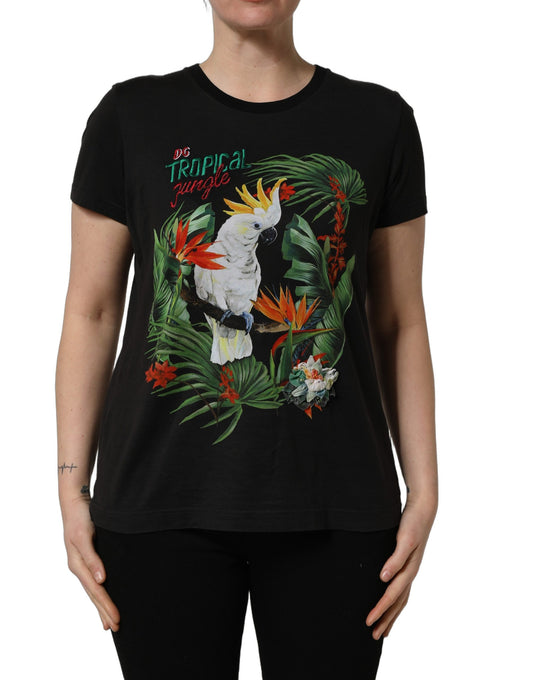 A black t-shirt with a tropical jungle print featuring birds and flowers