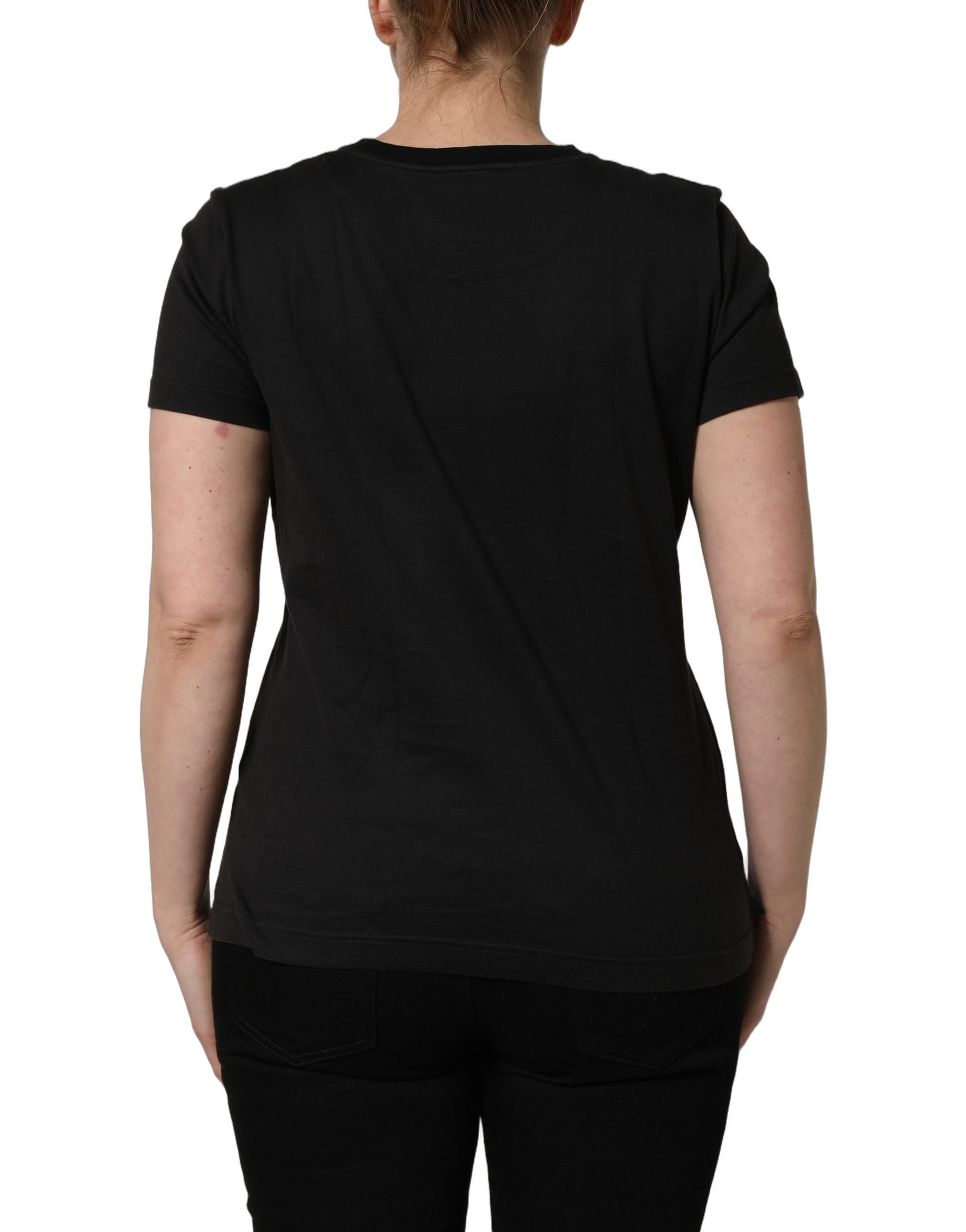 A black t-shirt with a tropical jungle print on the front