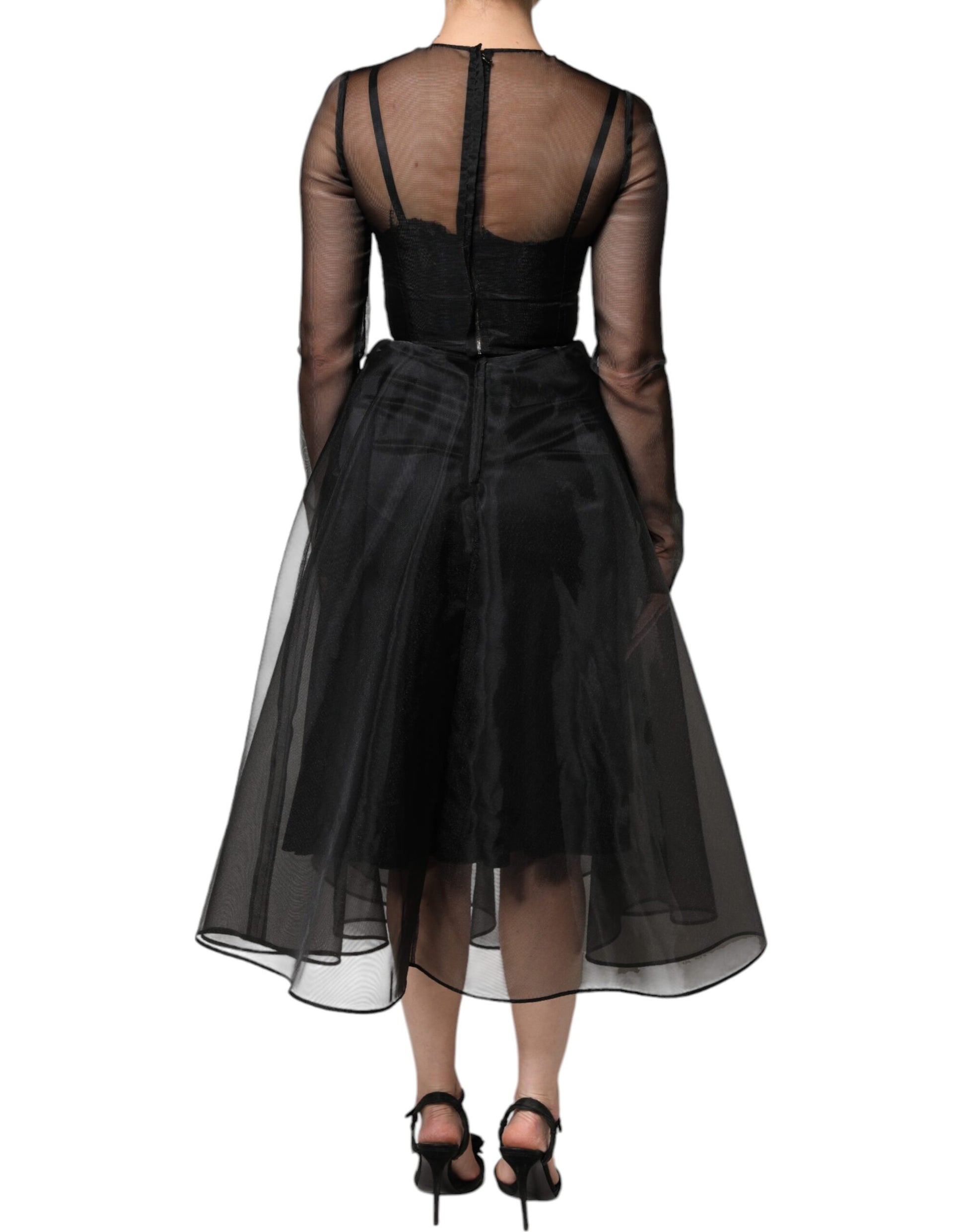Black tulle midi cocktail dress with sheer back and shoulders, featuring a fitted waist and flared skirt