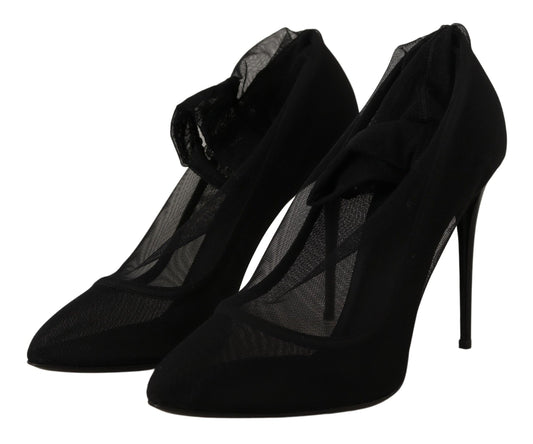 Pair of black high heel shoes with lace detailing and a mesh texture on the vamp