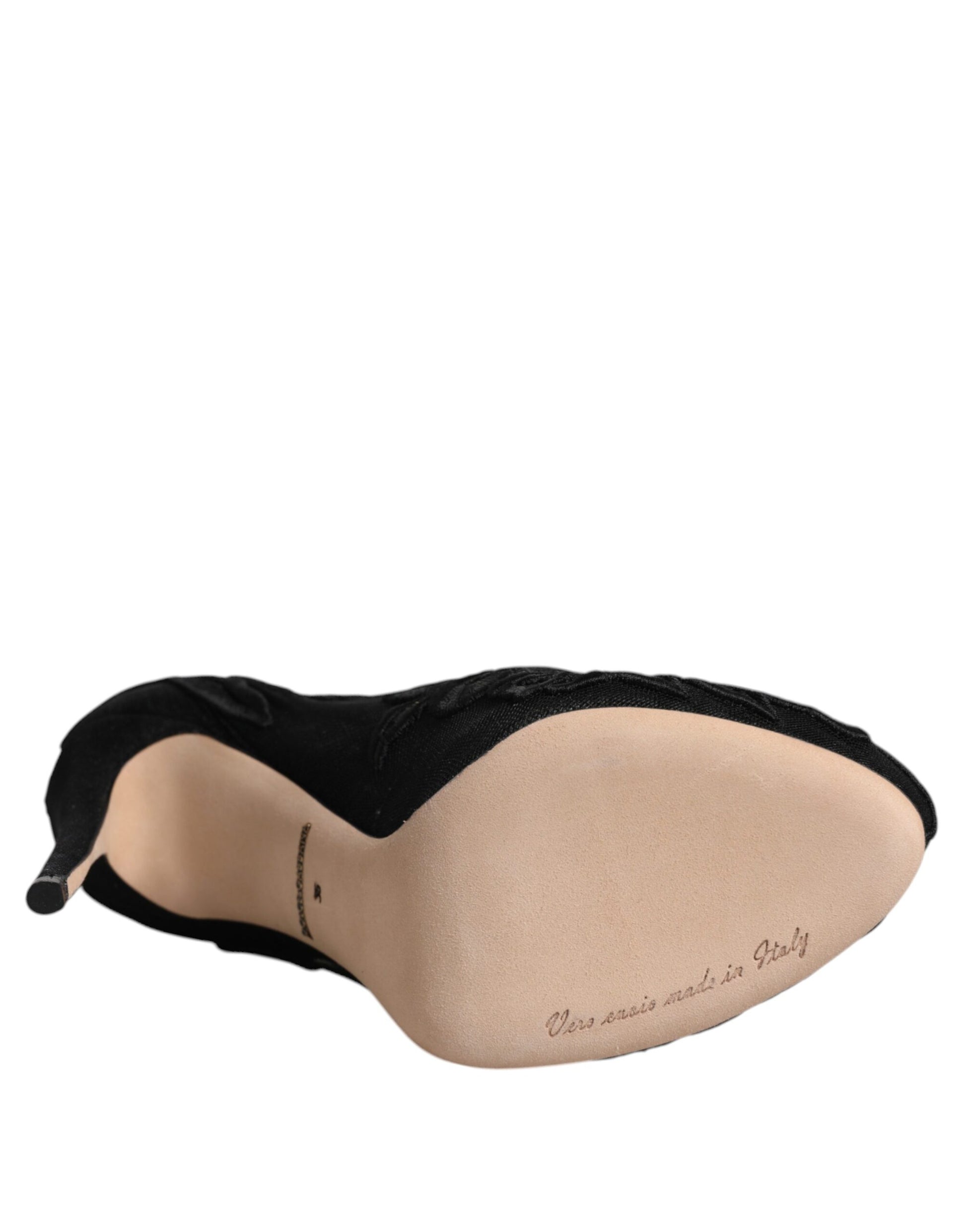 Black and tan stuffed animal pillow