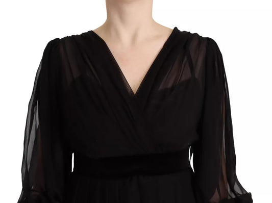A black long sleeve dress with a V-neck and an A-line silhouette