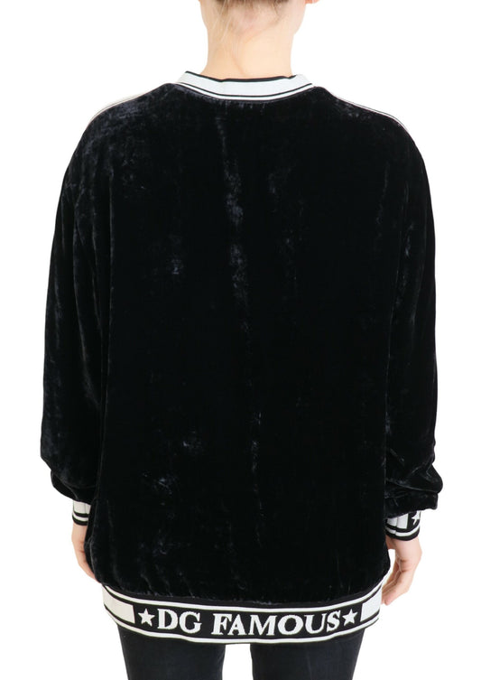 Black velvet jacket with white lettering on back
