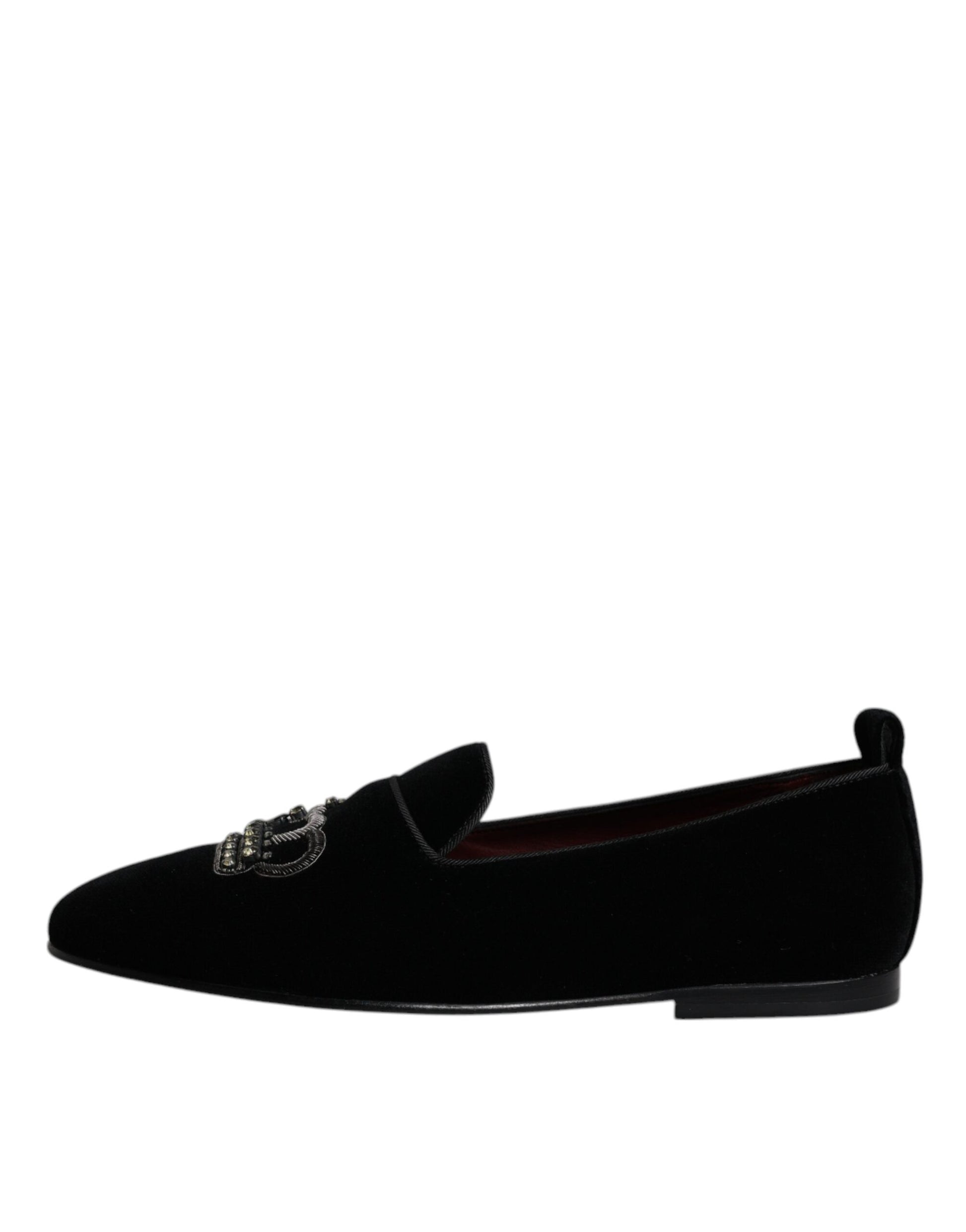 A pair of black velvet loafers with crystal embellishments