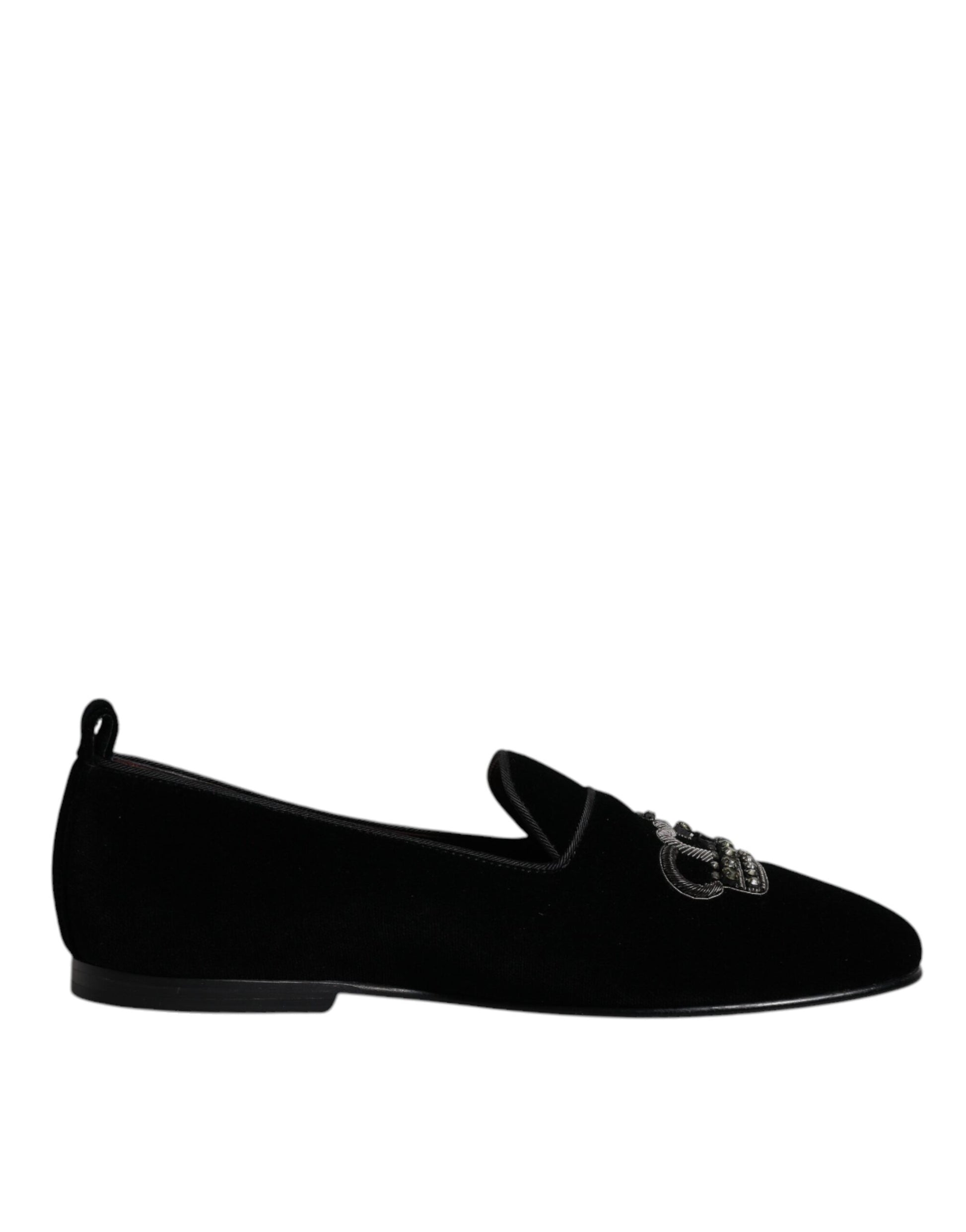 A pair of black velvet loafers with crystal embellishments