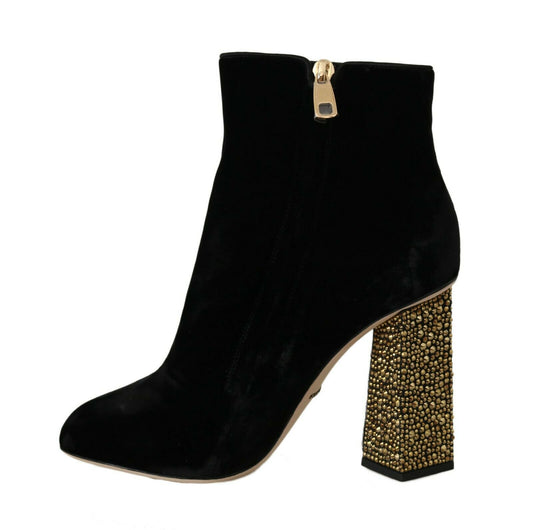 Black suede ankle boot with gold zipper and embellished heel