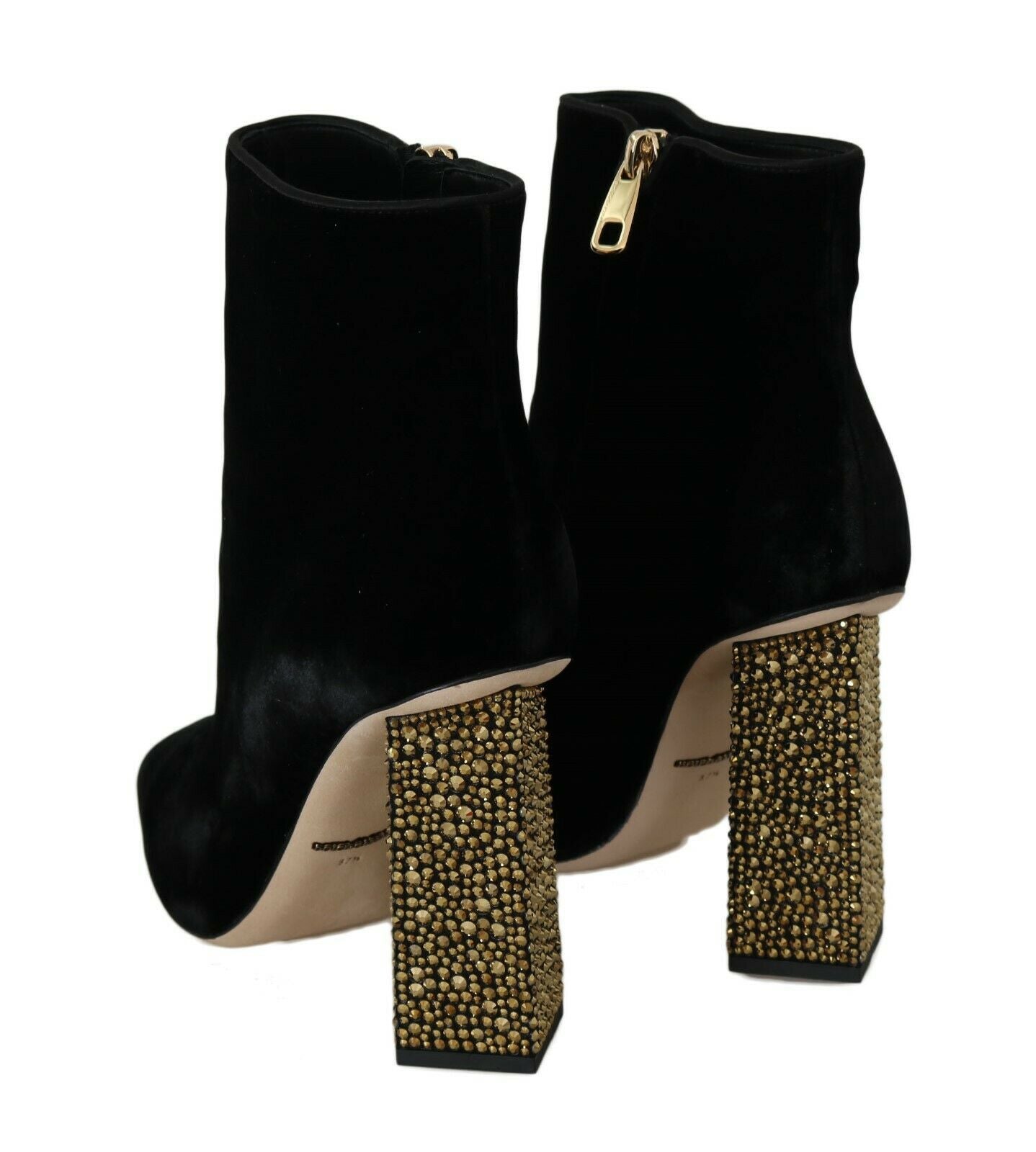 Pair of black suede ankle boots with gold studded heels and straps