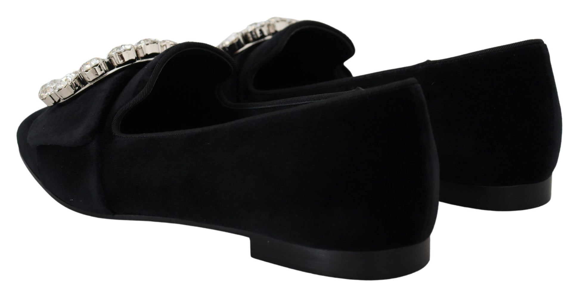 Pair of black suede shoes with silver buckles and heels