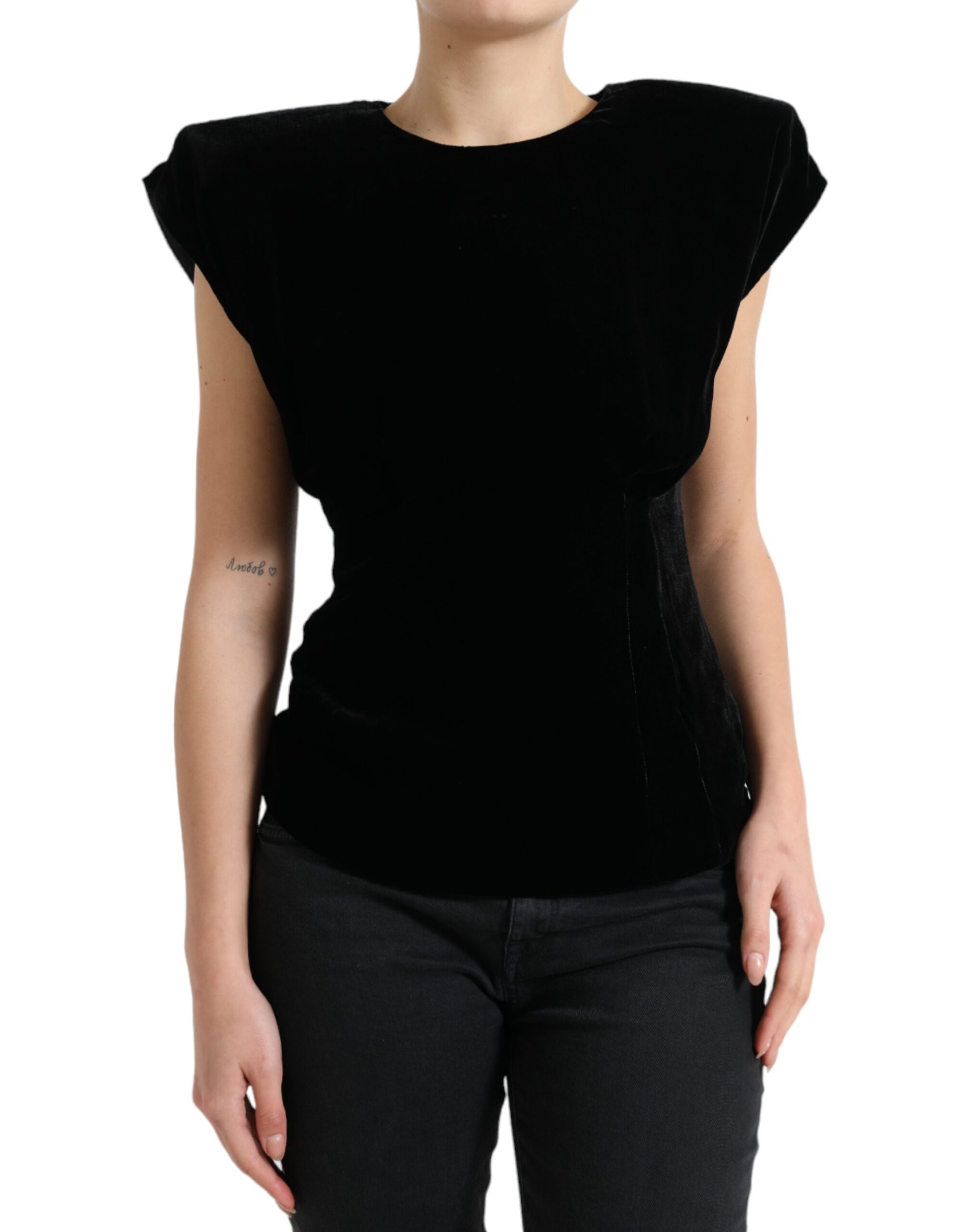 Black sleeveless top on a woman