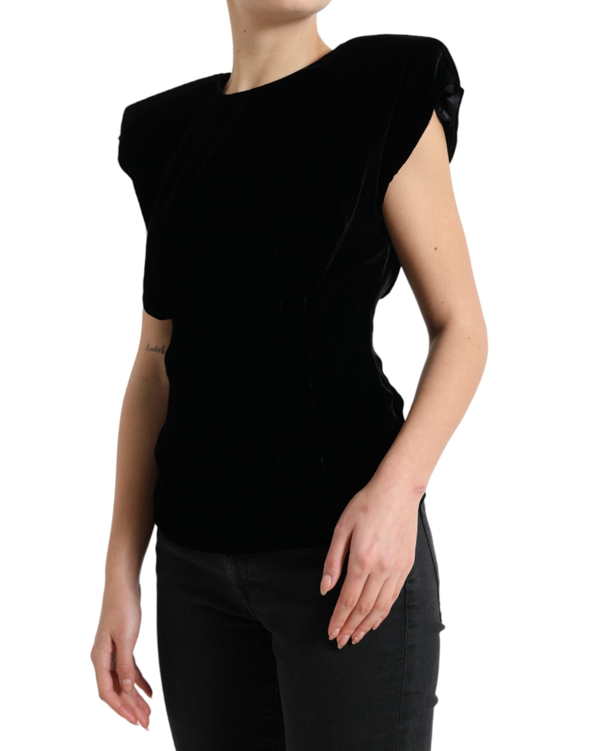 Black velvet sleeveless top on a model