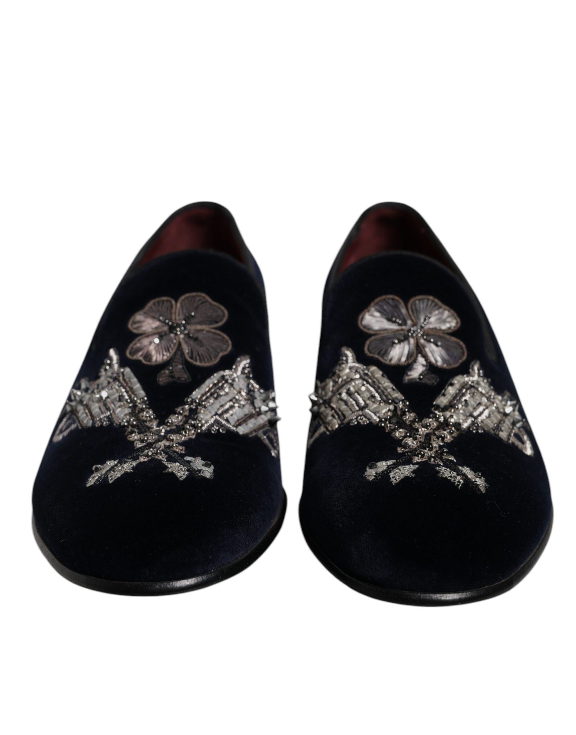 Pair of black velvet loafers with floral embroidery and gun motif