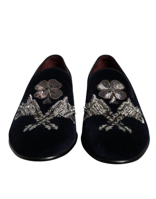 Pair of black velvet loafers with floral embroidery and gun motif