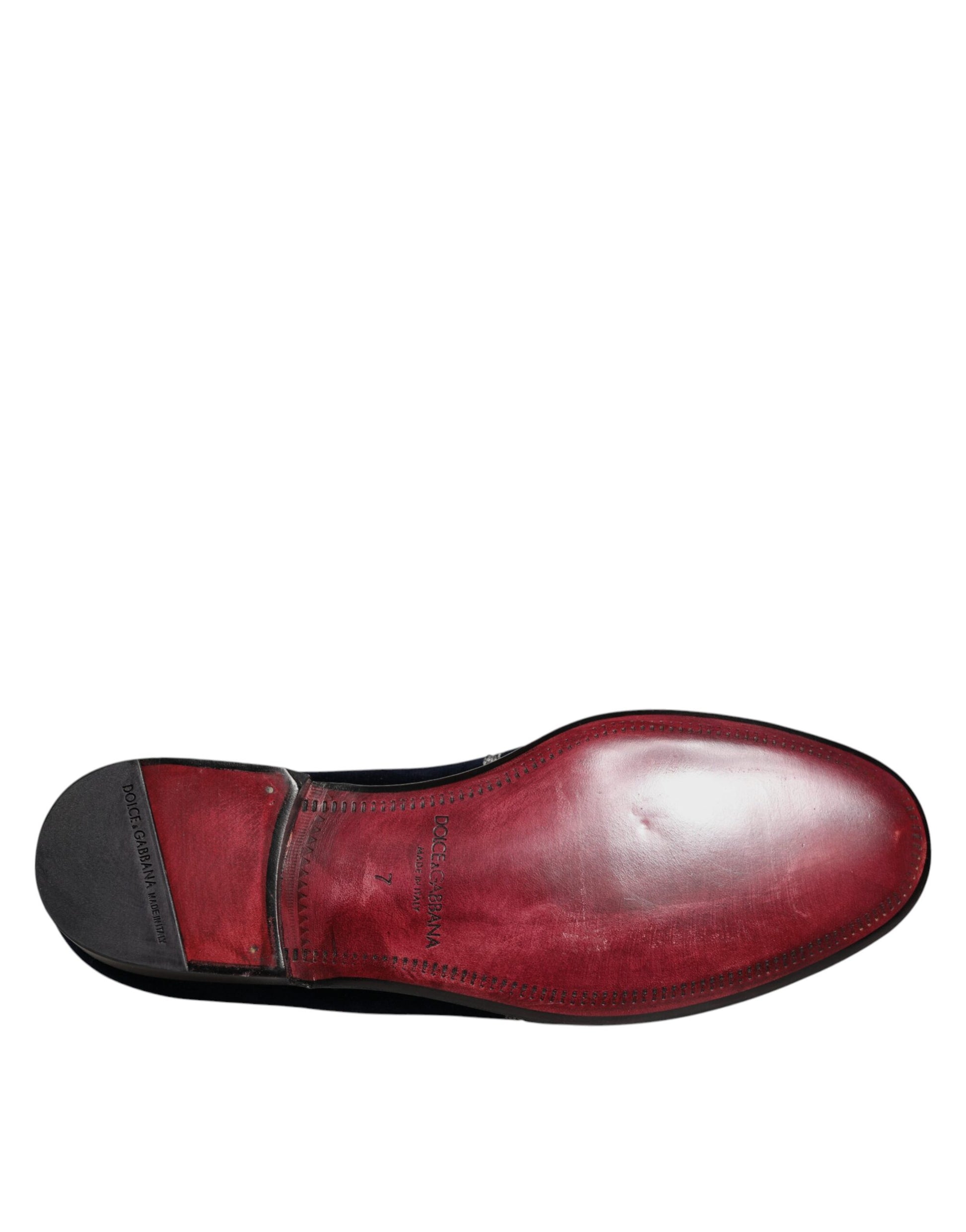 Red velvet loafer shoe with black stitching and floral embroidery