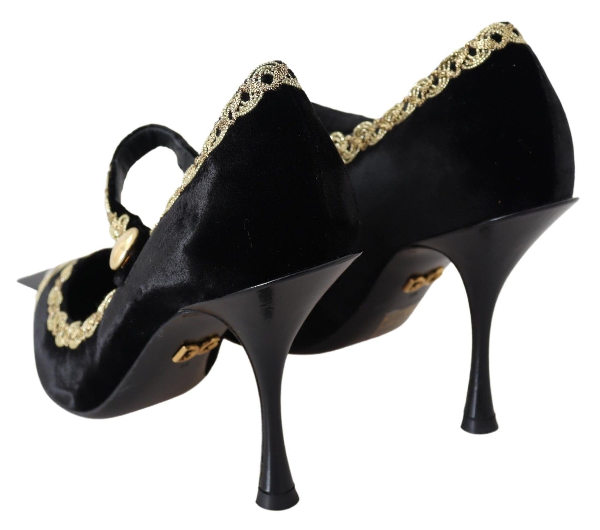 Pair of black velvet shoes with gold accents and heels