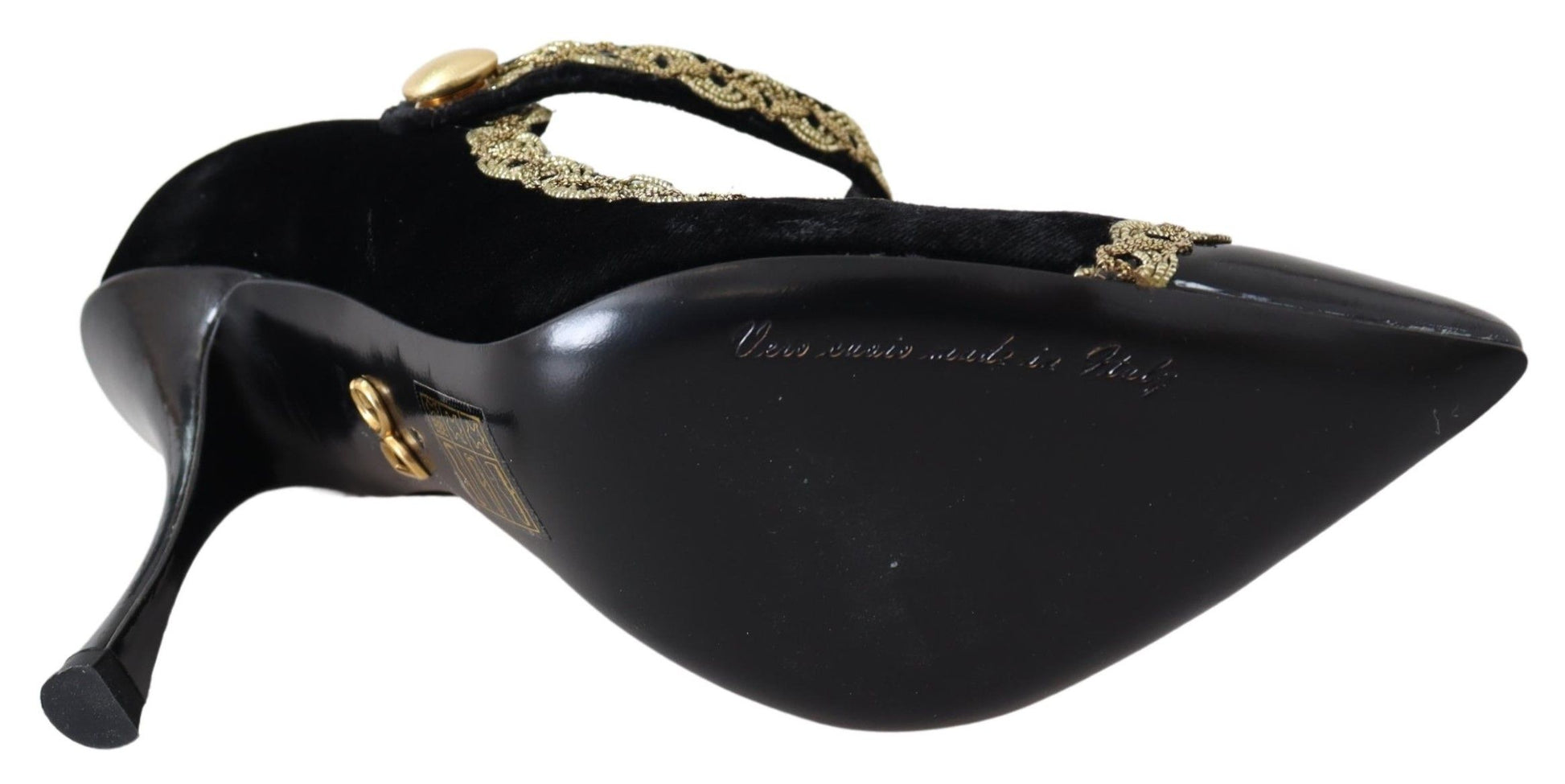 Black high heel shoe with gold accents and a strap over the foot
