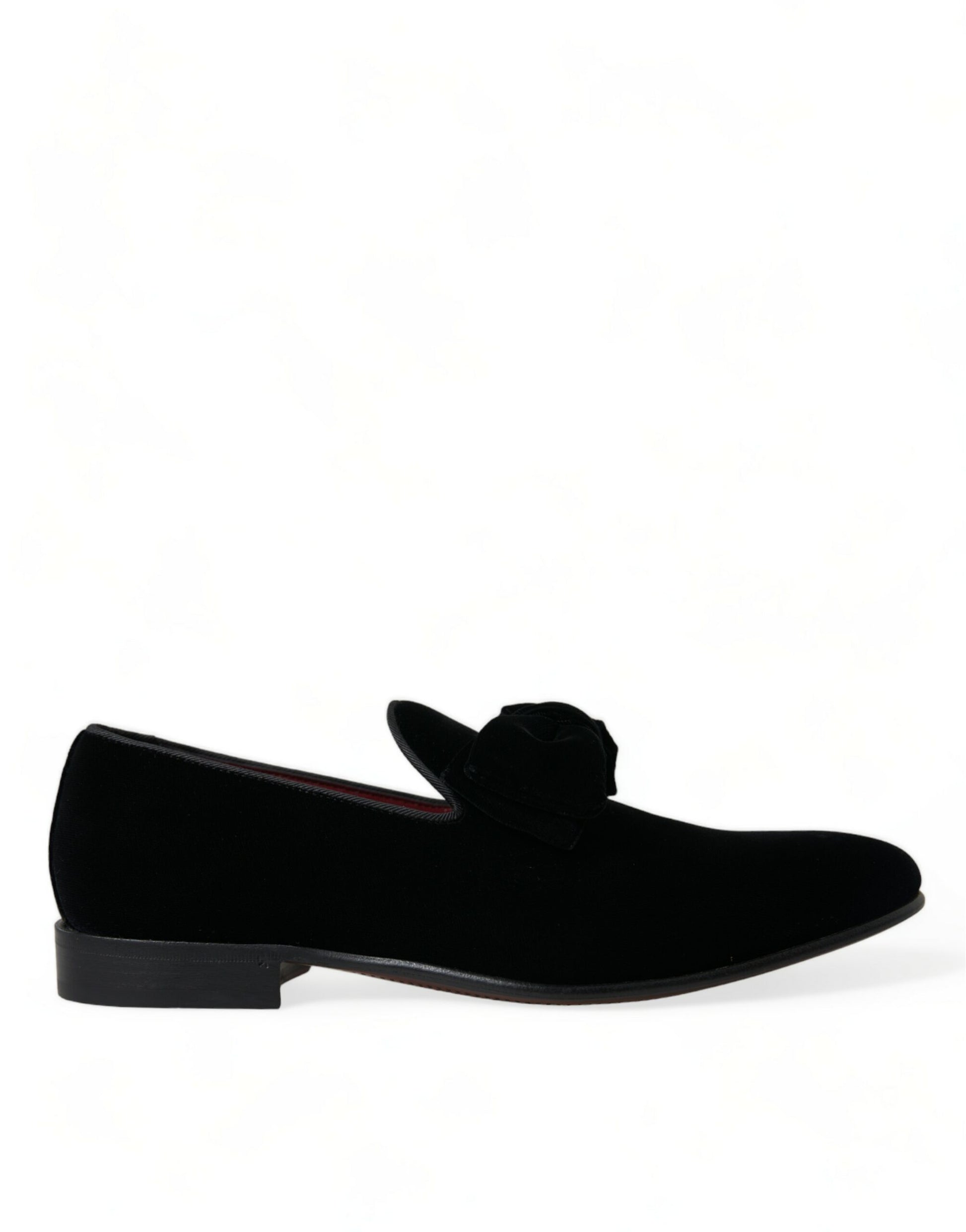 Black velvet loafer shoes with red trim and black soles