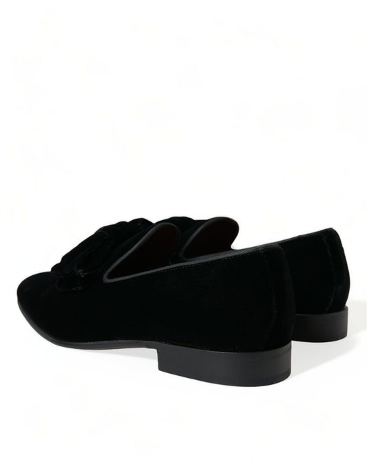 Pair of black velvet shoes with a low heel and elastic panels for comfort