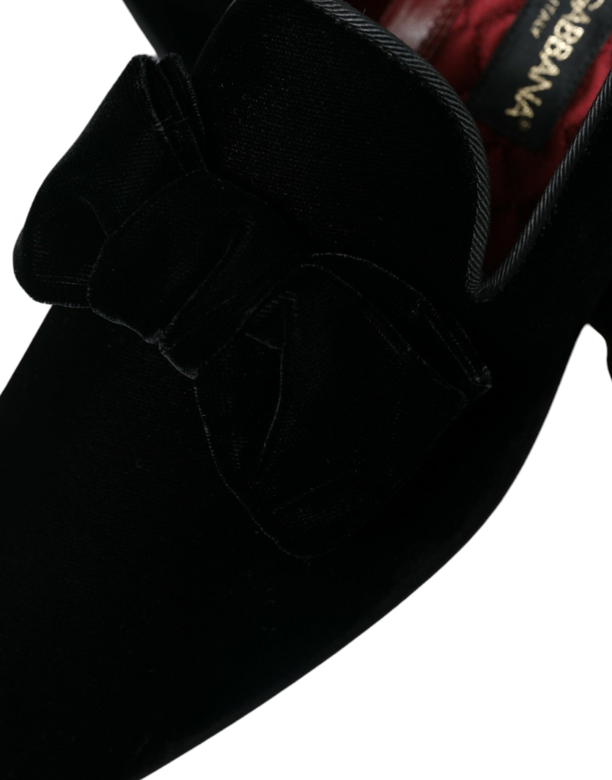Pair of black velvet loafers with bow detail on top