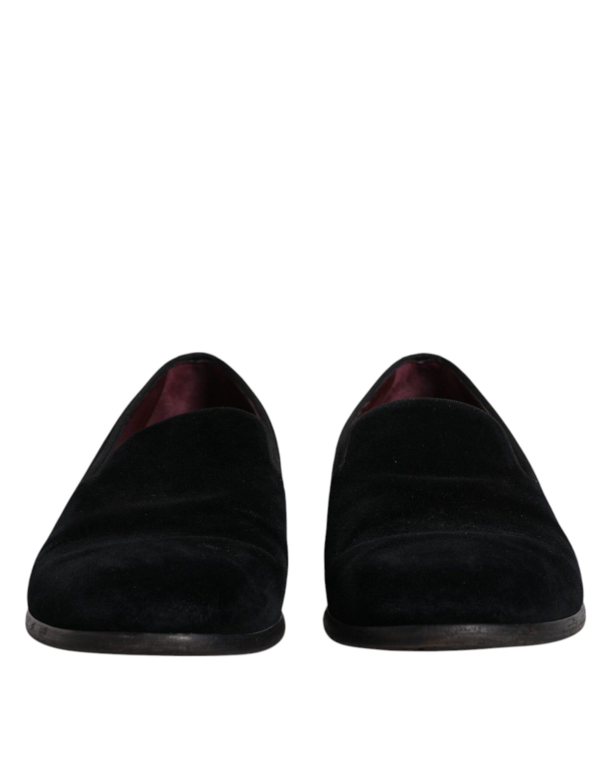 Pair of black velvet loafers with red trim, formal men's dress shoes