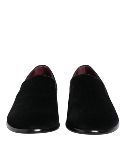 Pair of black velvet loafers with red lining, formal men's dress shoes
