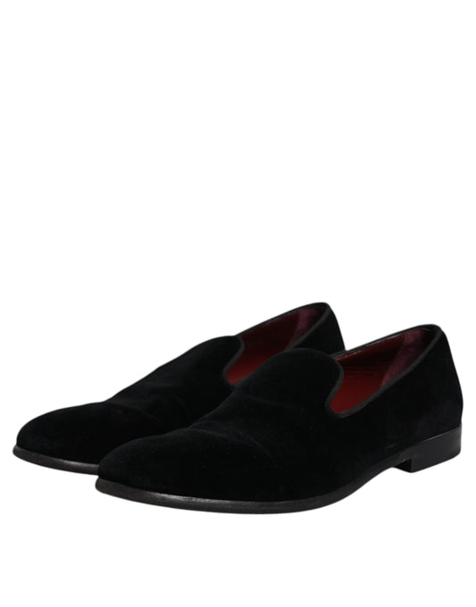 Pair of black velvet loafers with red accents, formal men's dress shoes