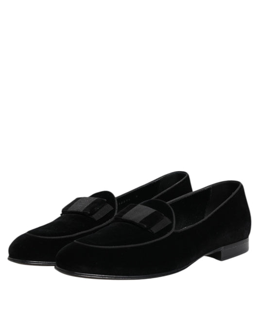 Pair of black velvet loafers with elastic panels, featuring a textured design and a low heel