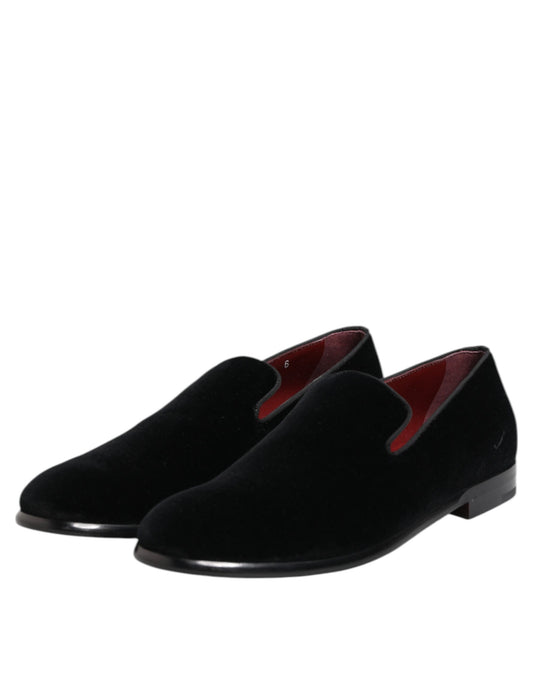 Pair of black velvet loafers with red accents, formal men's dress shoes